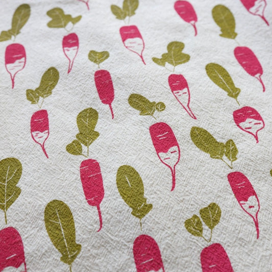 Pink and green radish pattern on white fabric