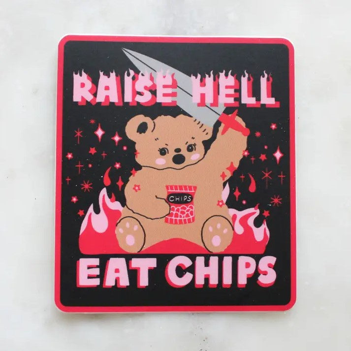 Square black sticker with hot pink and red accents depicting a teddy bear holding a sword and a bag of chips and captioned "Raise hell, eat chips"