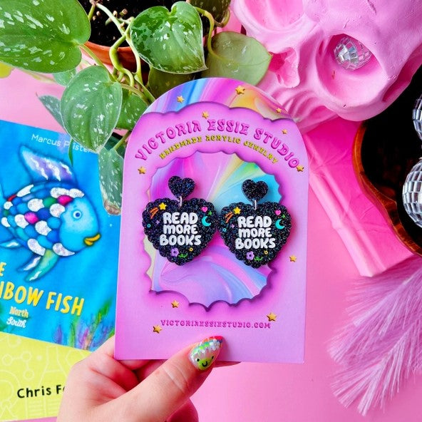 black heart read more books earrings with cute little drawings in the background like moon and stars