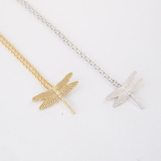 Necklace available in gold or silver featuring a small dragonfly pendant
