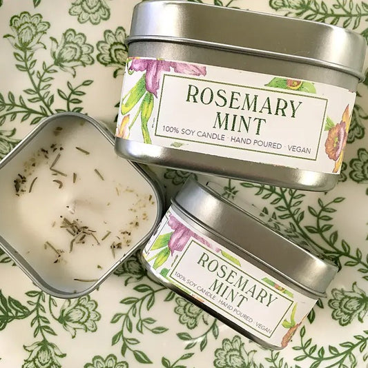 Rosemary mint scented candle in a metal tin with a floral label