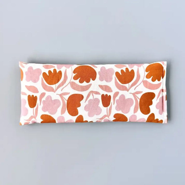 Organic lavender and flaxseed eye pillow in a simple orange, pink and white floral pattern