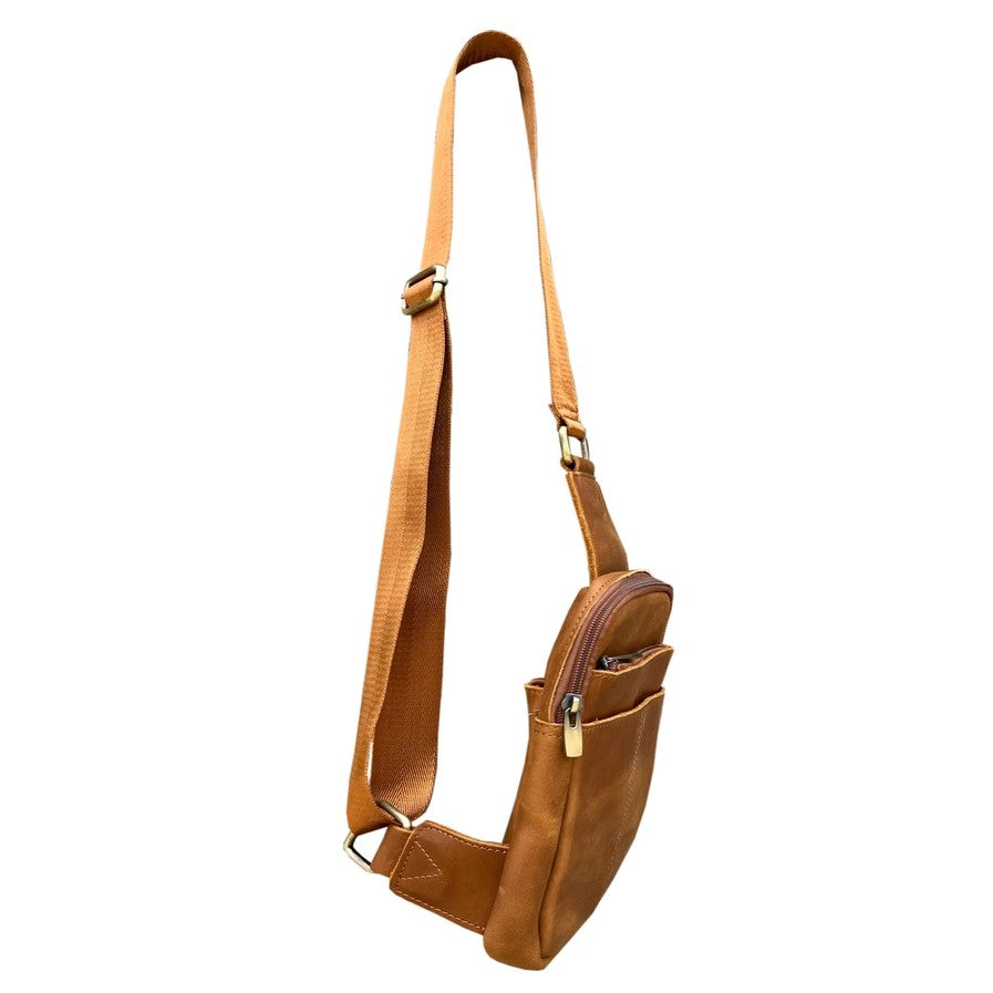 Light brown leather sling bag with an adjustable strap