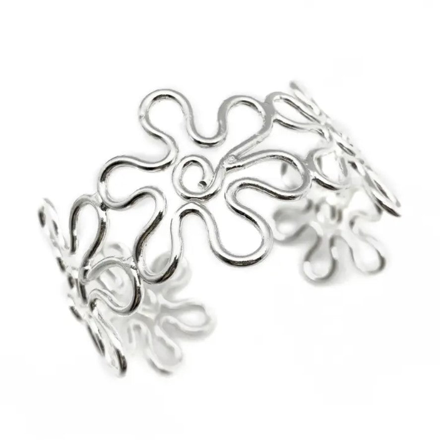 Silver adjustable cuff bracelet shaped like loopy connected flowers