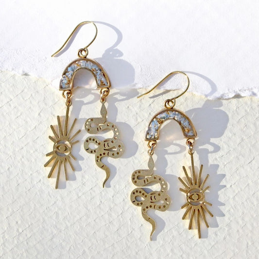 gold snake and sun eye earrings with a rainbow filled with gemstones