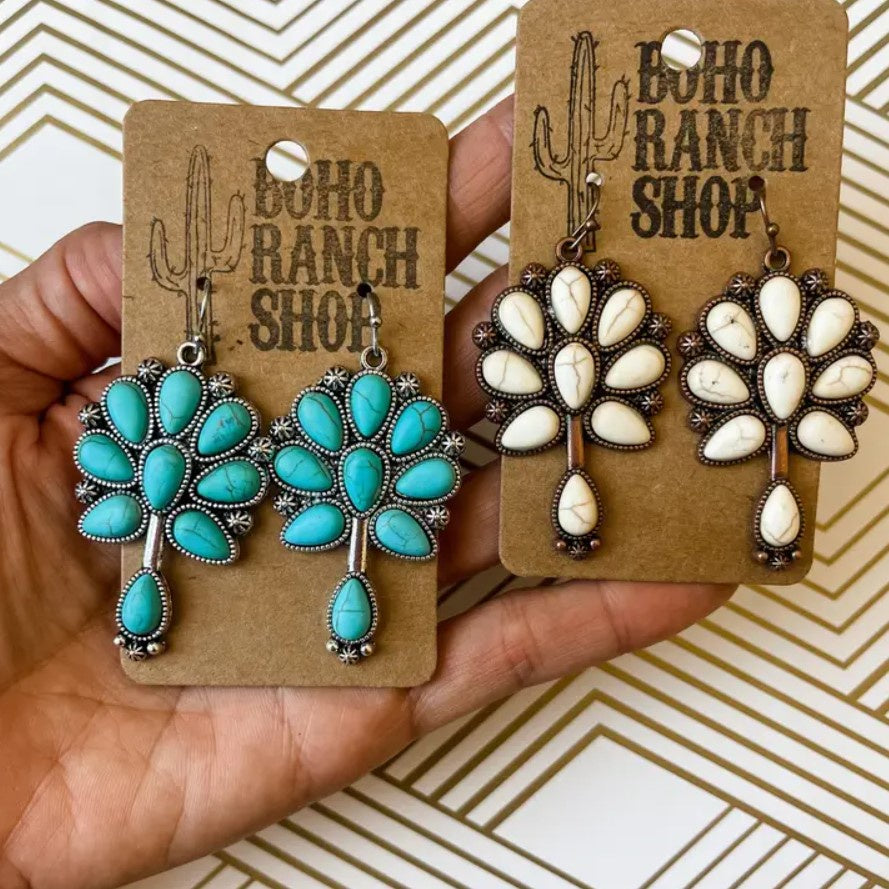 Earrings available with turquoise or white stones in the shapes of flowers
