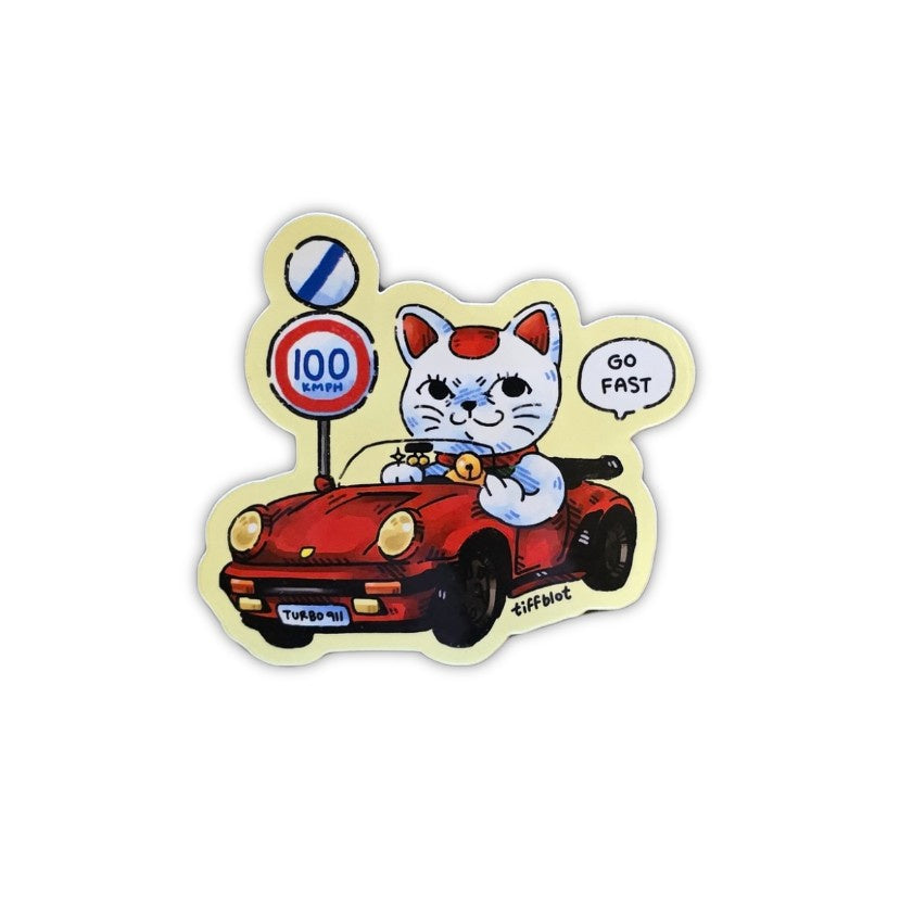 Sticker of a white cartoon cat in a bright red car smiling and giving the middle finger