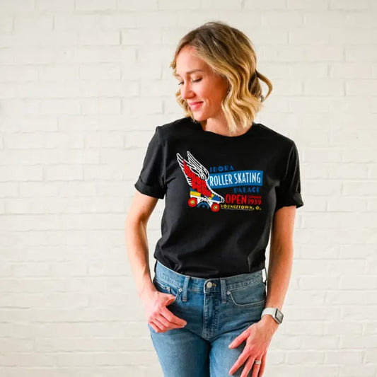 Black t-shirt featuring a blue, white, red and yellow logo for "Idora Roller Skating Palace" with a winged roller skate