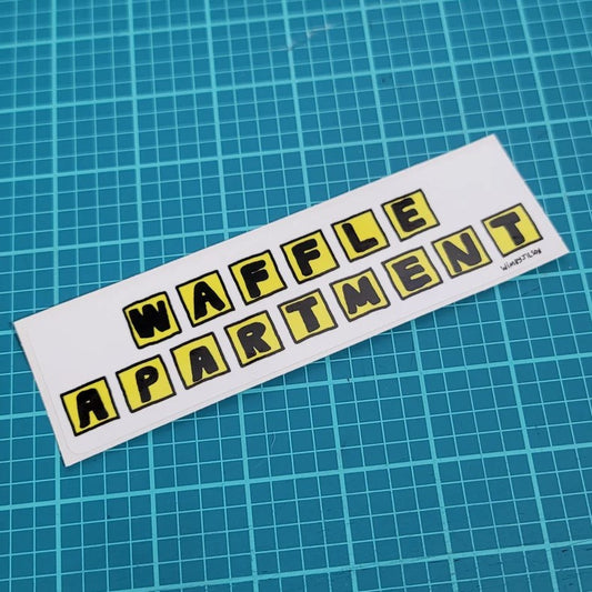 Sticker in the style of the Waffle House sign that reads "Waffle Apartment"