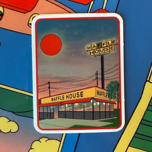 Sticker with an illustration of a Waffle House restaurant at dawn underneath a red sun