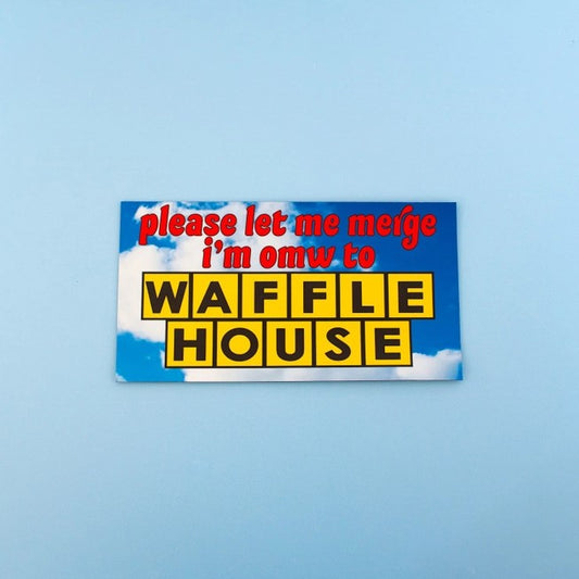 Bumper magnet that reads "please let me merge I'm omw to Waffle House" over a blue cloudy sky background