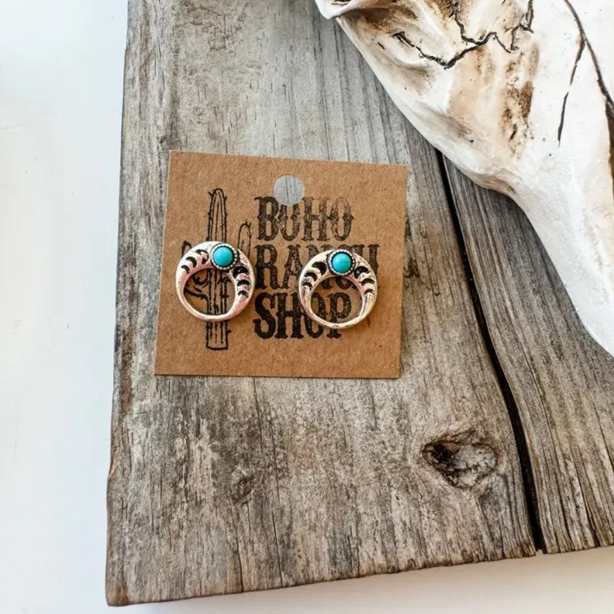 Circular silver earrings with turquoise stones and crescent moon etchings