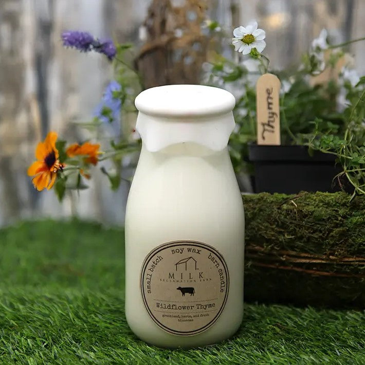 Candle shaped like an old fashioned milk jar in the scent "Wildflower Thyme"