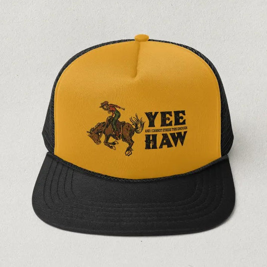 Yellow and black ball cap featuring an image of a woman riding a bucking horse and the words "Yee, and I cannot stress this enough, haw"