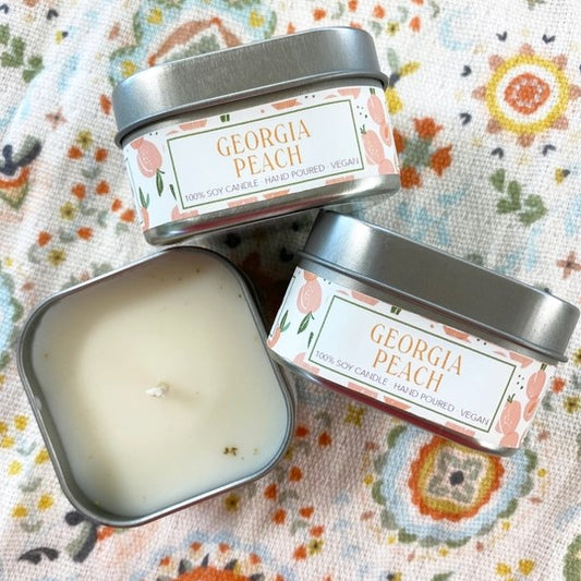 Three Georgia Peach Soy Candles showing inside of candle and packaging of prodcut