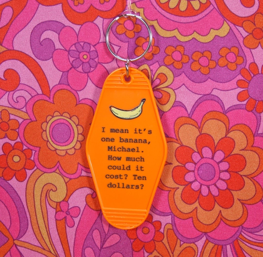 orange key chain with Lucille Bluth Quote featuring a banana above quote