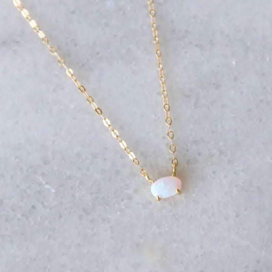 Small oval opal necklace on a gold chain