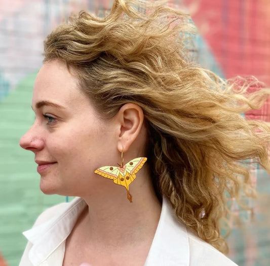wood colorful moth earrings on model
