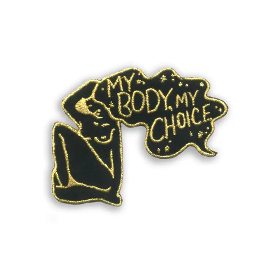 Patch with body of women and her hair has the quote "my body, my choice"