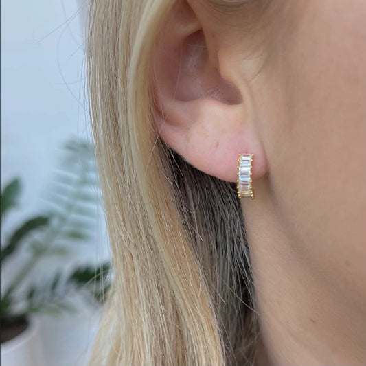 Model wearing huggie earrings by nikki smith jewelry
