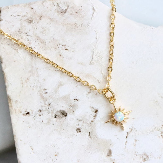 Opal starburst necklace on a gold chain