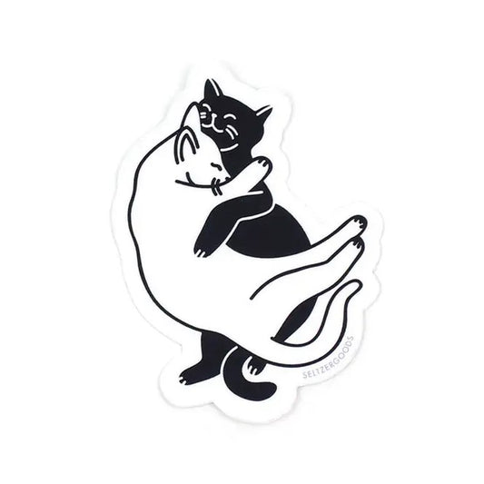 Cats snuggling in black and white on a sticker