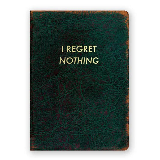 Dark green notebook with leather pattern and gold text that reads "I regret nothing"