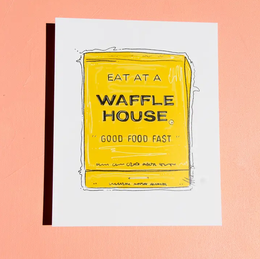 an 8x10 print of a bright yellow matchbox that reads "eat at a waffle house, good food fast" on a white background