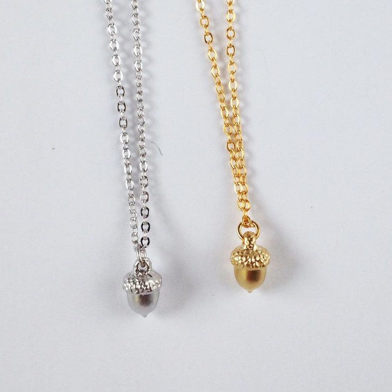 Necklace available in gold or silver color with small acorn shaped pendant