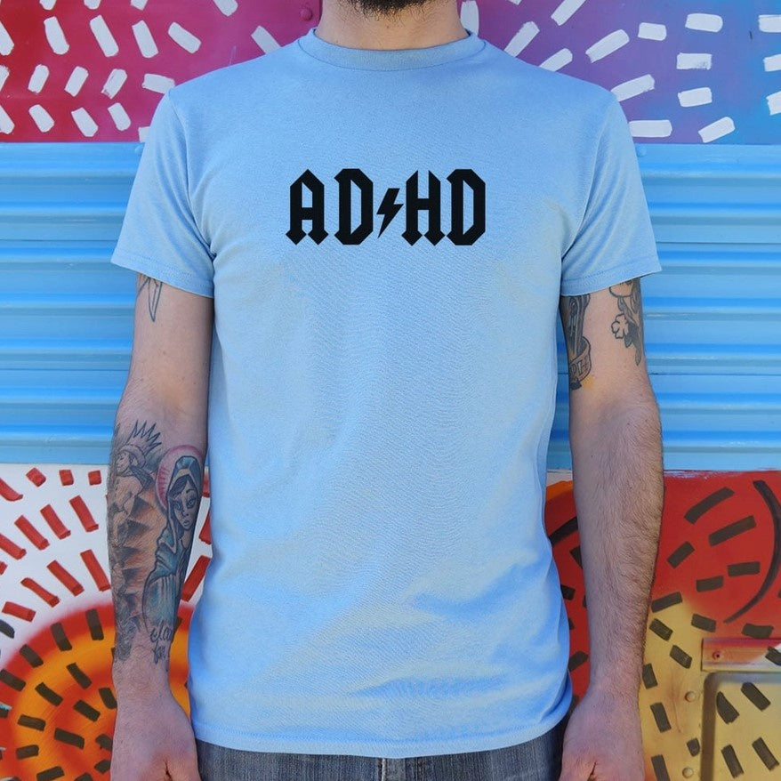 A light blue tee shirt with the word "ADHD" drawn in the style of the ACDC logo