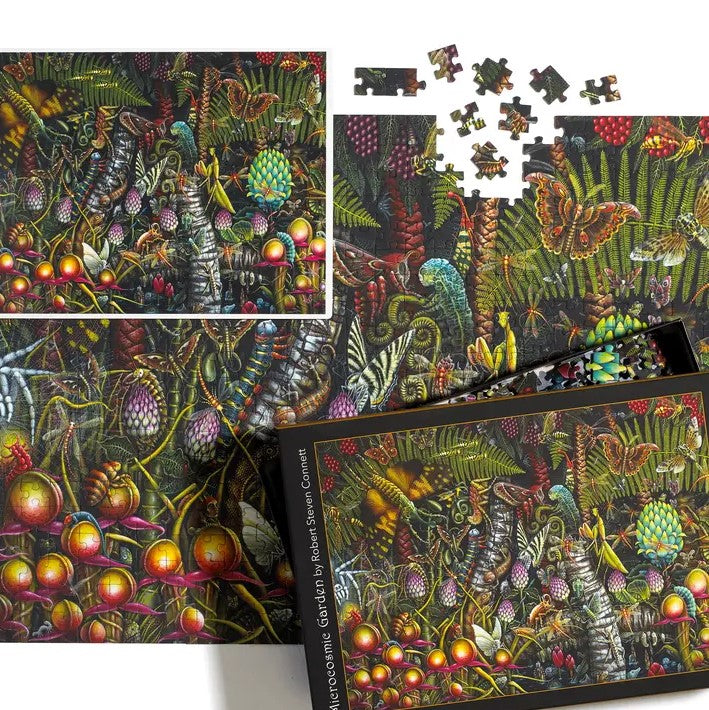 A five hundred piece puzzle featuring a detailed illustration of many different kinds of insects and lizards interacting amidst colorful foliage.