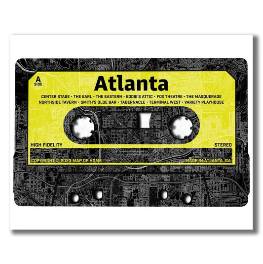 Print of a map of Atlanta imposed on a cassette tape in black, white and bright yellow 