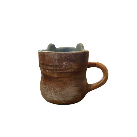Brown ceramic mug with handle and blue interior