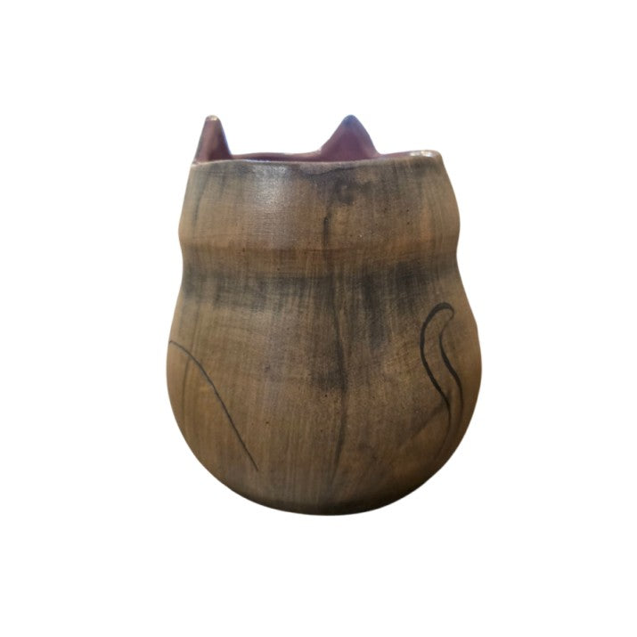 Back of brown vase with tail painted on