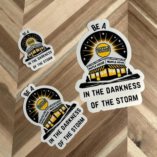 Sticker depicting a Waffle House restaurant and the caption "Be a Waffle House in the darkness of the storm"