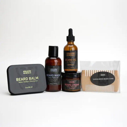 Collection of beard care products including oil, beard wash, and beard comb