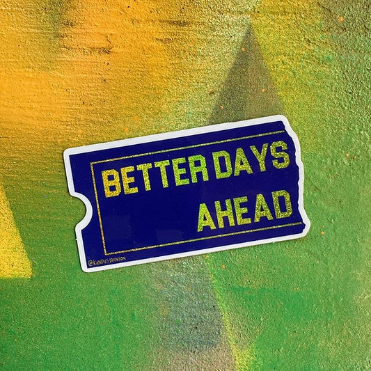 Blue and yellow glittery sticker shaped like a ticket stub with the words "Better Days Ahead" on it