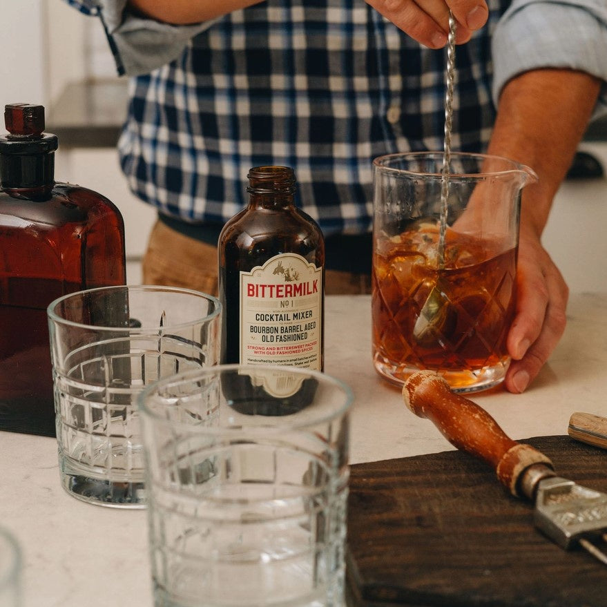 man stirring a cocktail mixer