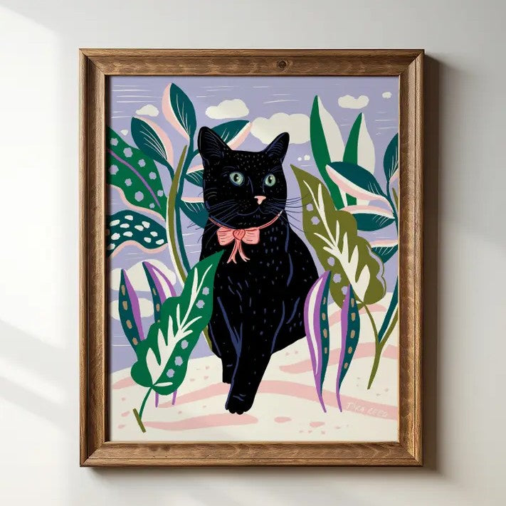 Artwork of a black cat with a pink bow around its neck surrounded by leafy plants
