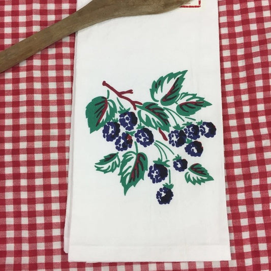 White kitchen towel with a graphic of a blackberry branch