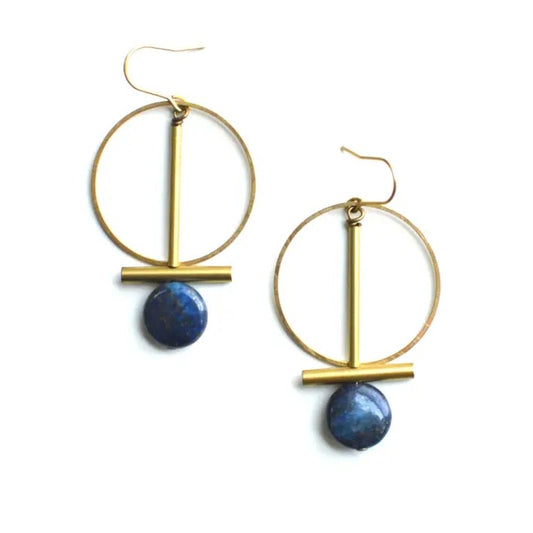 A pair of gold-toned geometric dangle earrings with blue gems at the bottom