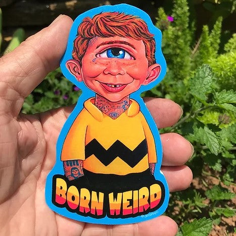 Hand holding magnet with Mad Magazine character