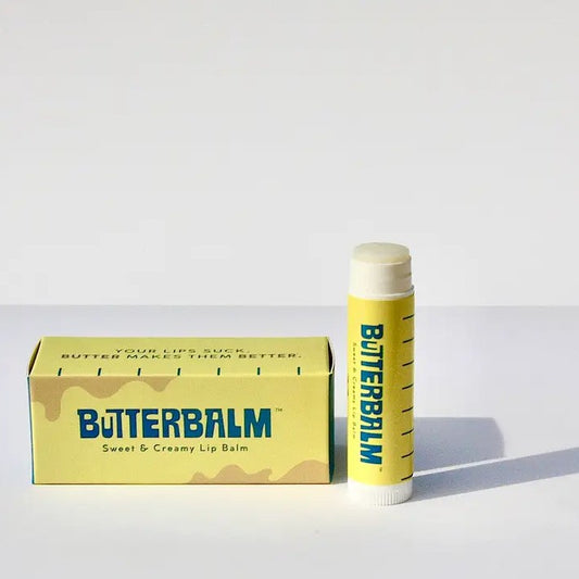 Tube of lip balm which comes in a box shaped like a stick of butter
