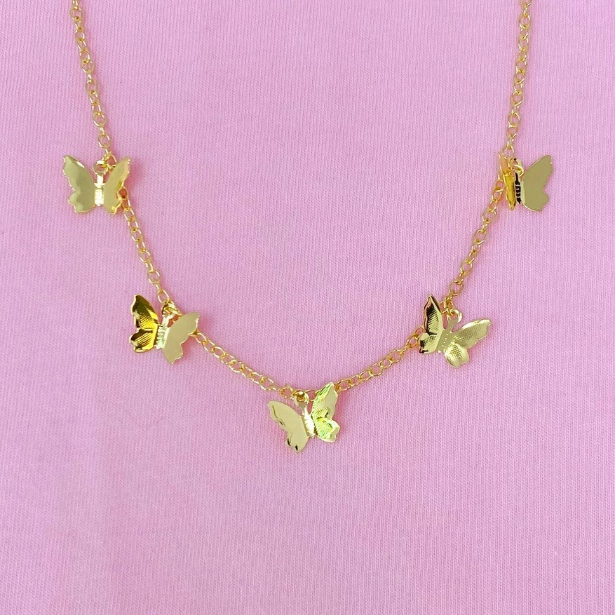 necklace with five delicate gold butterfly charms in the center