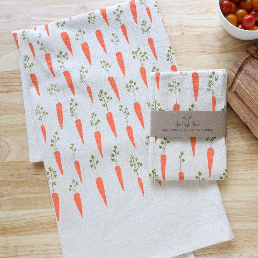 Hand printed white cotton towel with an orange carrot pattern
