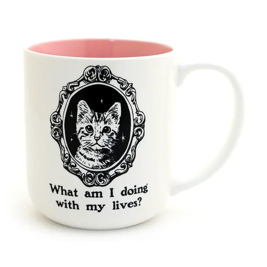 White mug with a light pink interior and picture of a kitten with caption "What am I doing with my lives?"