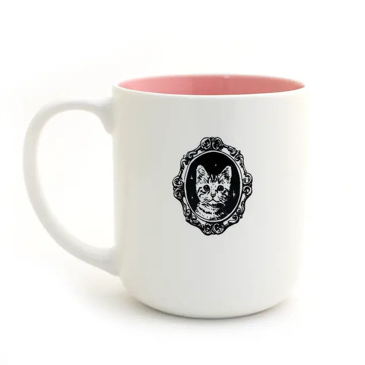 White mug with pink interior and cat illustration on a white background