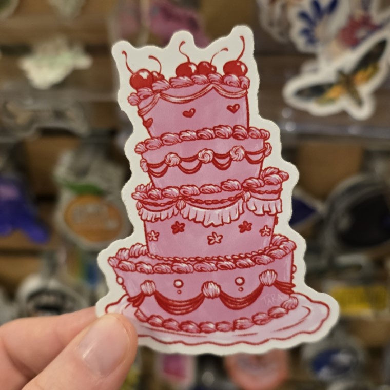 vinyl sticker of a fancy and slightly crooked four layer pink cake with cherries on top