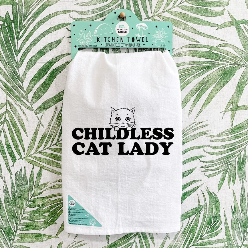 childless cat lady kitchen towel with a cat graphic peering over the text