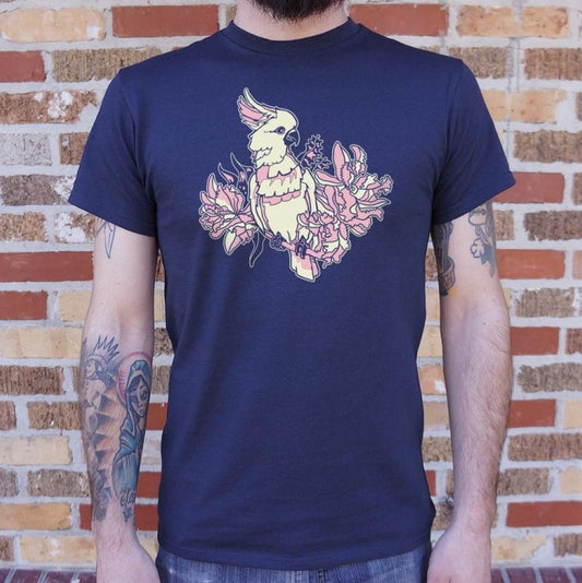 A dark blue tee shirt featuring a pale yellow and pink image of a cockatoo standing on a flowery branch.